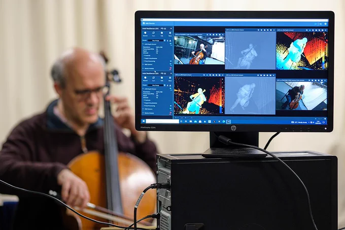 Musician being recorded using digital audio and LiDAR camera methods as part of the ARME data collection sessions.