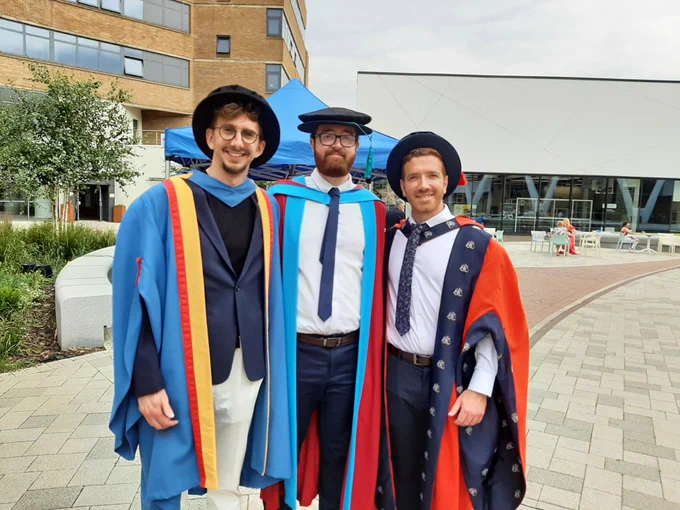 Three Doctors stood together 