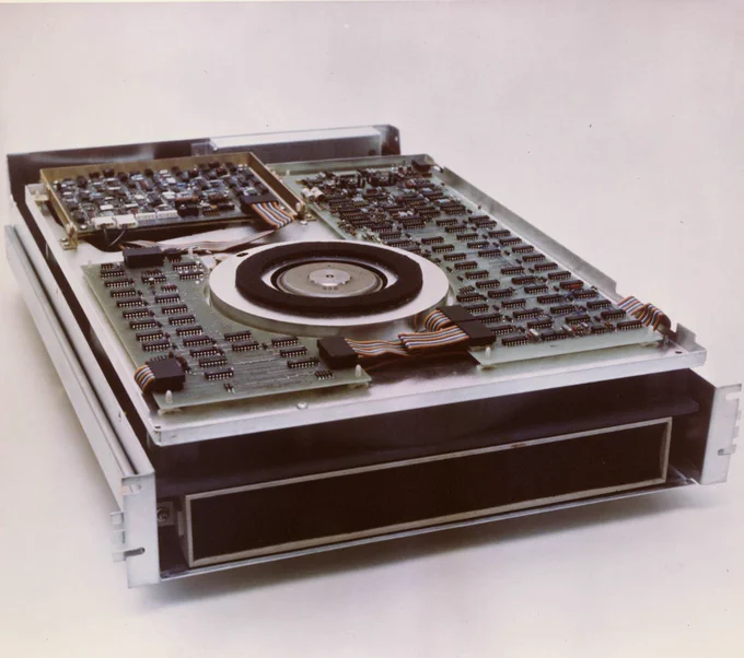 CBI Image of the Day. Square color photograph. A look inside the 9414 Fixed Media Disk Drive (Falcon-OEM Equipment)-built for Control Data. The top cover or shell is removed. Background an off white.