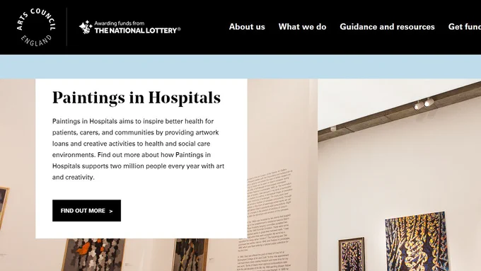 The artscouncil.org.uk website featuring a section on Paintings in Hospitals. Text is on a photographic background of an art exhibition. The text reads: Paintings in Hospitals aims to inspire better health for patients, carers, and communities by providing artwork loans and creative activities to health and social care environments. Find out more about how Paintings in Hospitals supports two million people every year with art and creativity.