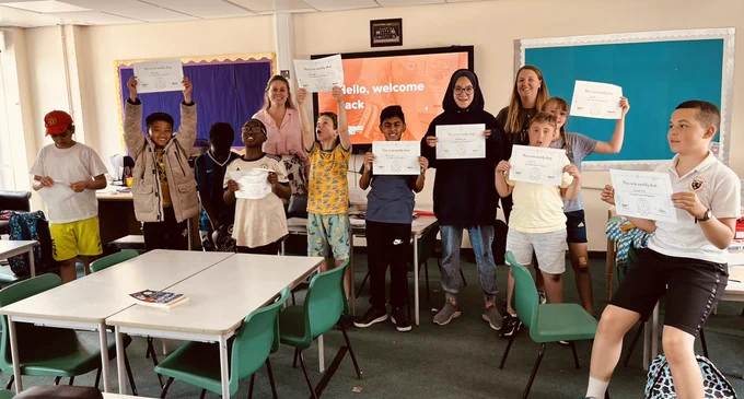 Group picture of Design Club students with their certificates.