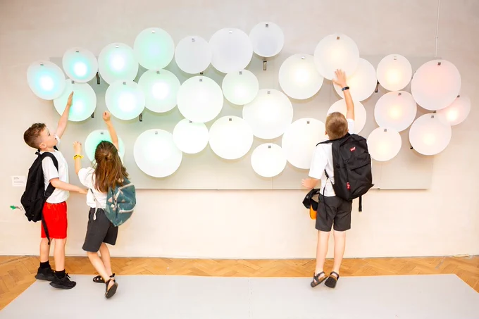 Children play with one of the exhibits