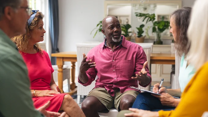 A group of people sits and talks