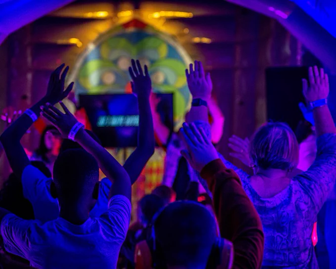 Young people worship with their hands in the air during our 3Generate Youth Conference.