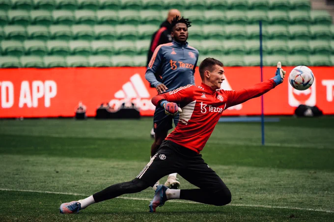 Matej Kovar makes a save in training as Fred watches on from behind.
