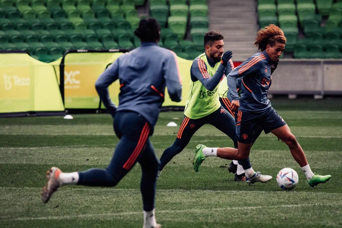Hannibal in possession in training, with Alex Telles closely behind.