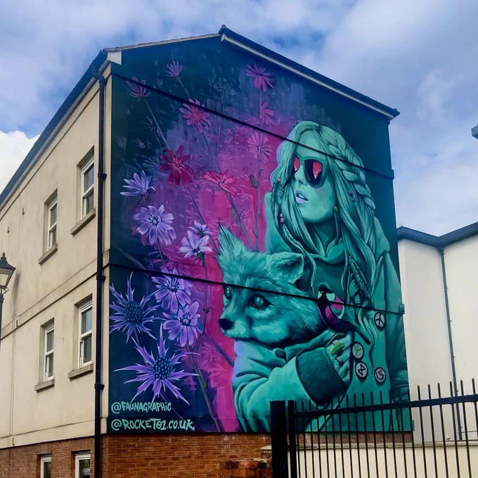 street are by @faunagraphic of a lady in sunglasses holding a fox