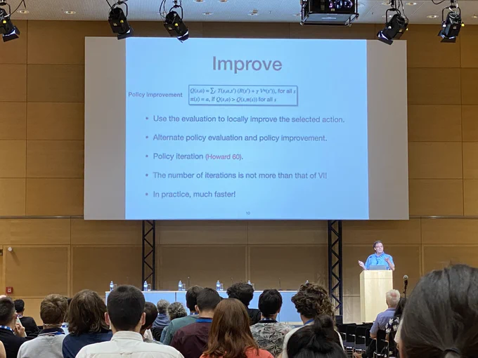 Mike Littman’s IJCAI 2022 McCarthy Award lecture. Slide title: Improve (presents policy iteration)