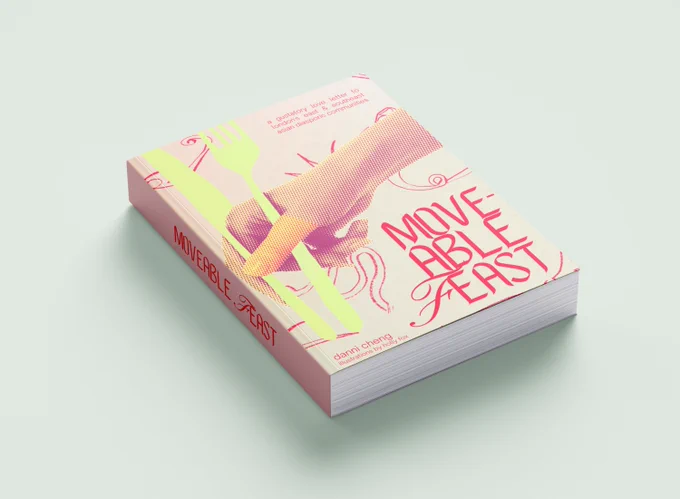 Book with cover of hands holding fork and knife as chopsticks with title  'Moveable Feast'