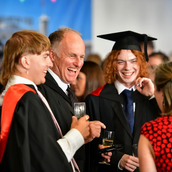 grads enjoy the drinks reception
