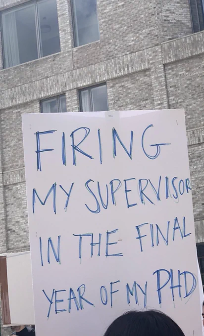 Protest sign that reads ‘firing my supervisor I. The final year of my PhD’