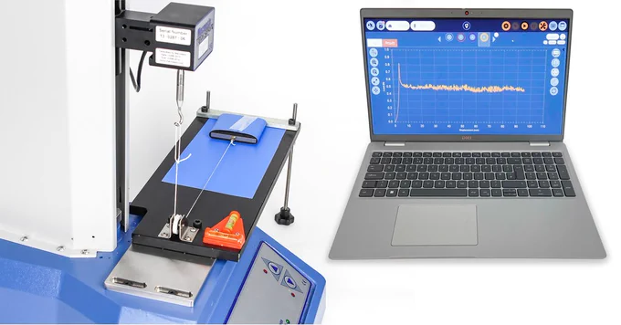 Coefficient of Friction test fixture and graphical results displayed on a laptop