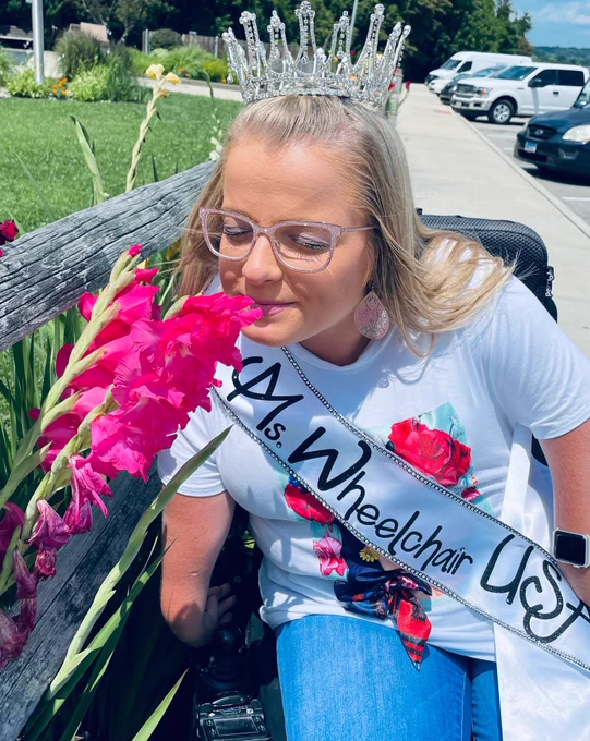Sara smells the flowers