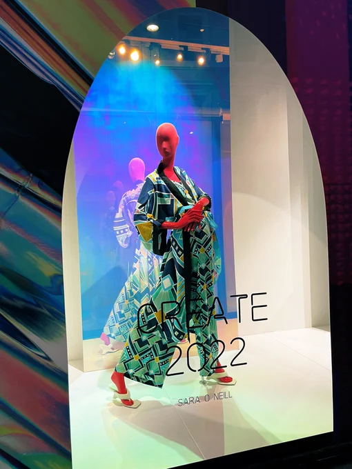 Department store window showing mannequin model dressed on Belfast Designer Sara O’Neill kaftan and palazzo trousers  in the Millie print