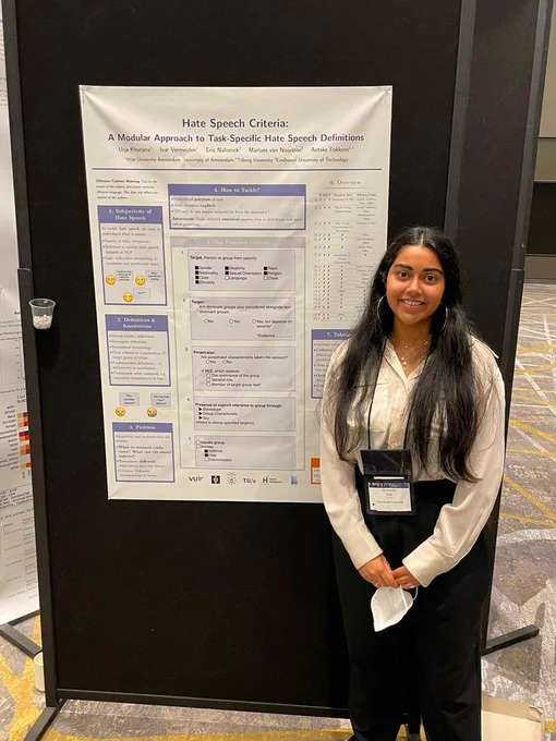 I am standing next to my poster on hate speech definitions. 