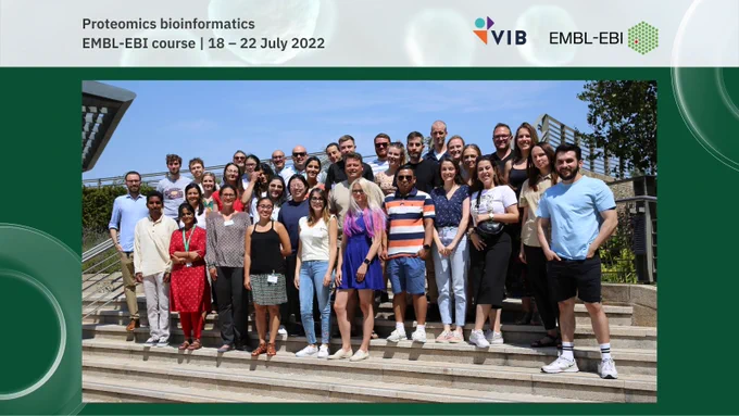 A group of people stands on some stone steps outside. The words proteomics bioinformatics, EMBL-EBI course, 18 - 22 July 2022 are written at the top of the image. The VIB and EMBL-EBI logos are shown.