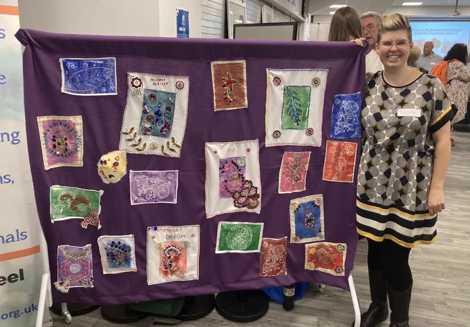 A community textiles banner made by women in Deeplish
