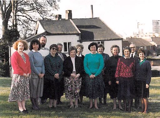The Hospiscare team stand outside their Mowbray Cottages offices in the mid 1980s