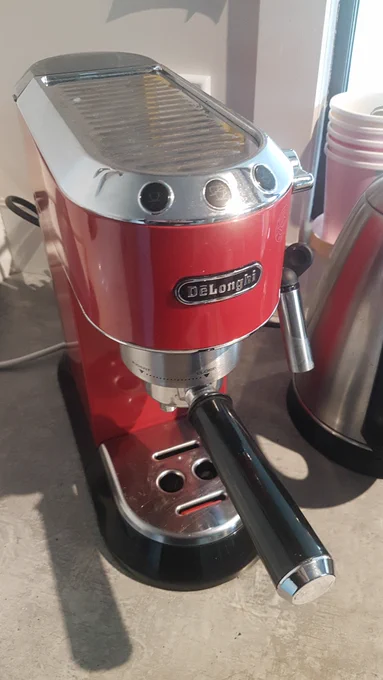 Red Delonghi coffee machine