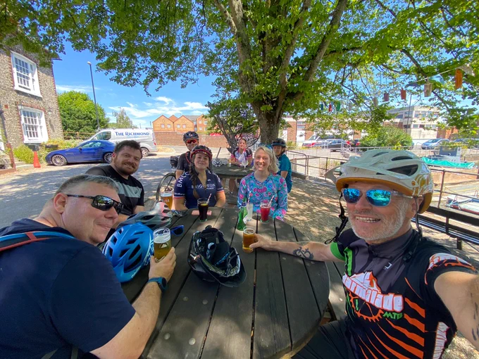Smiling people at pub table
