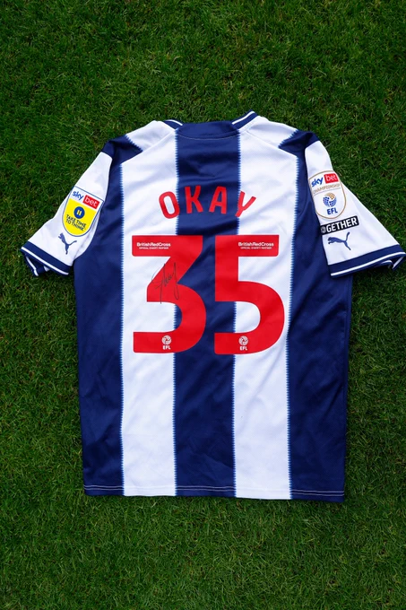 A home shirt signed by Okay Yokuslu.