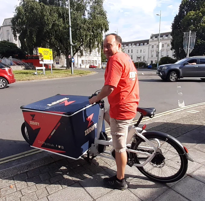 A member of the Zedify team takes a courier bike out for a spin