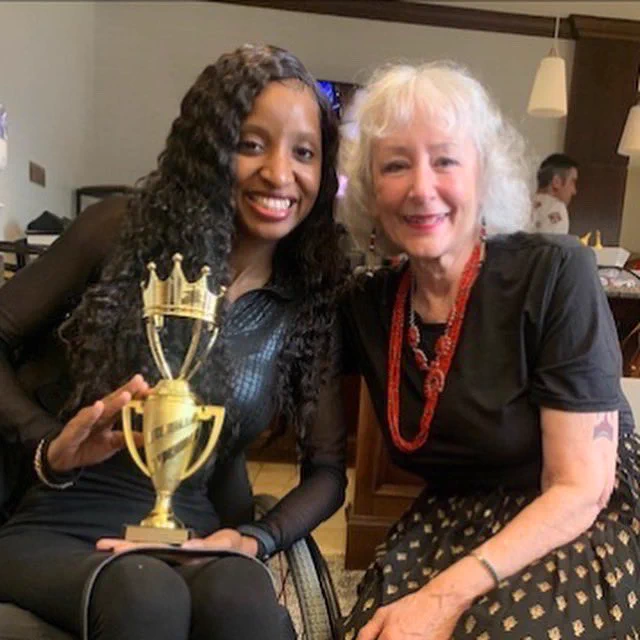 Bianca pictured with Dr. Georgi Hudson-Smith the morning after the pageant with her trophy.