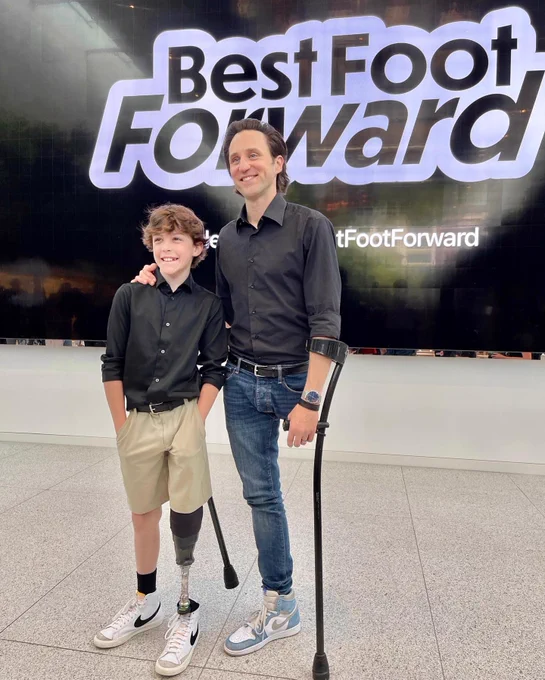 Boy with prosthetic leg and one legged man