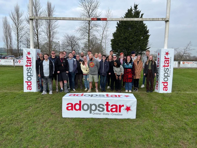 Adopstar staff on rugby pitch