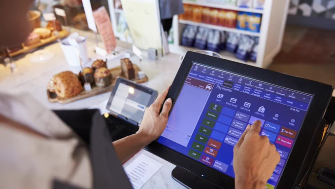 Restaurant worker completing a digital transaction