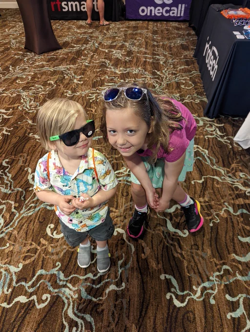 Valarie's two youngest children, 3 and 8 years old, sporting sunglasses and other trinkets from the aforementioned companies. 