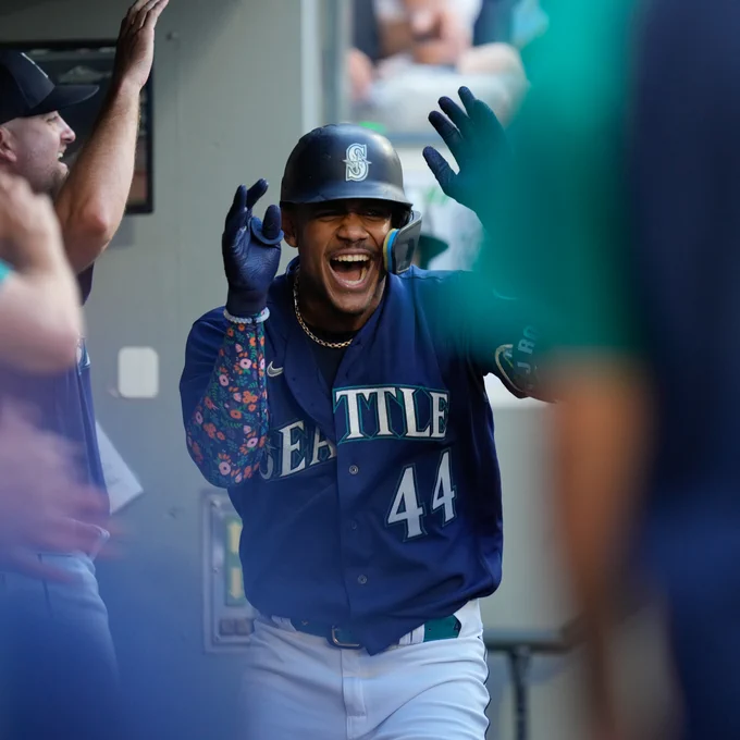 Julio Rodríguez is all smiles in the dugout.