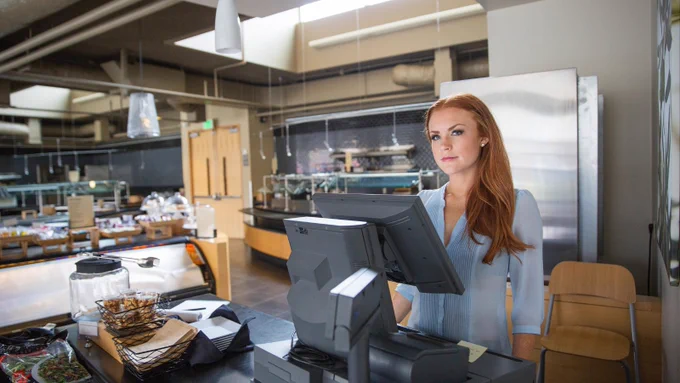 Restaurant worker handling finances 