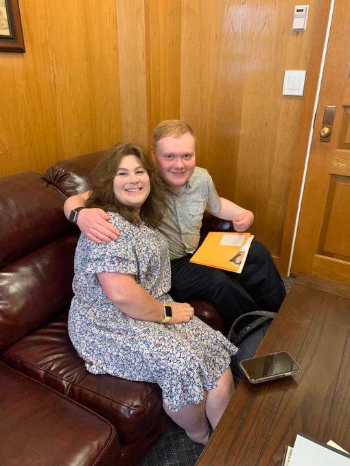 Nancy Gardner and Jonathan Gardner sitting in office