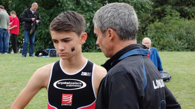 A young Alex Yee getting coaching advice from his coach (JH)