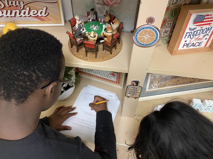 Students organizing their thinking in a table.