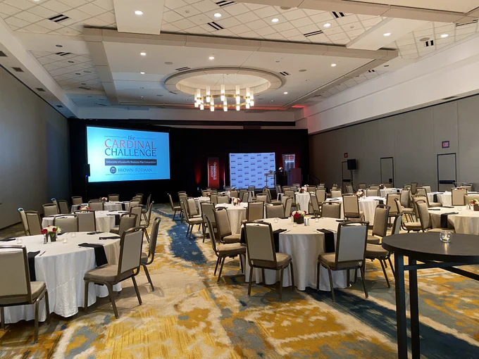 Conference room with circle tables and chairs.