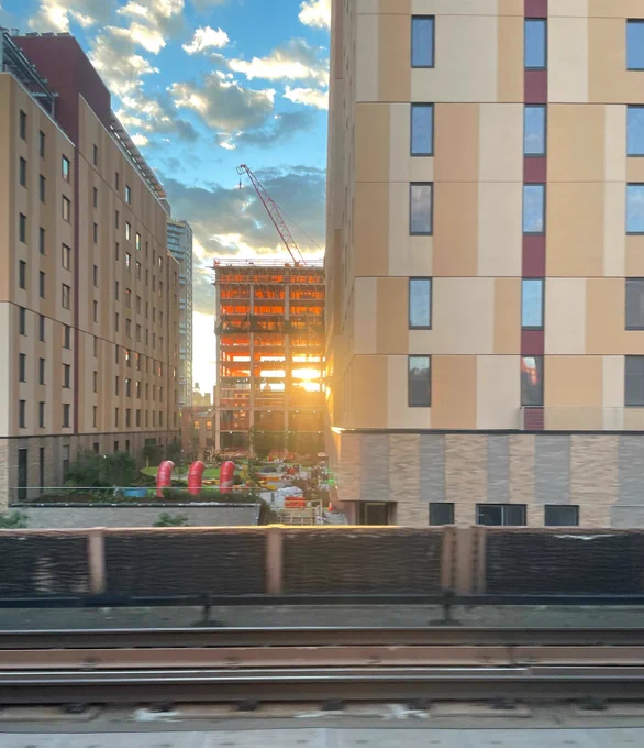 The construction of building A at Sendero Verde during sunset.