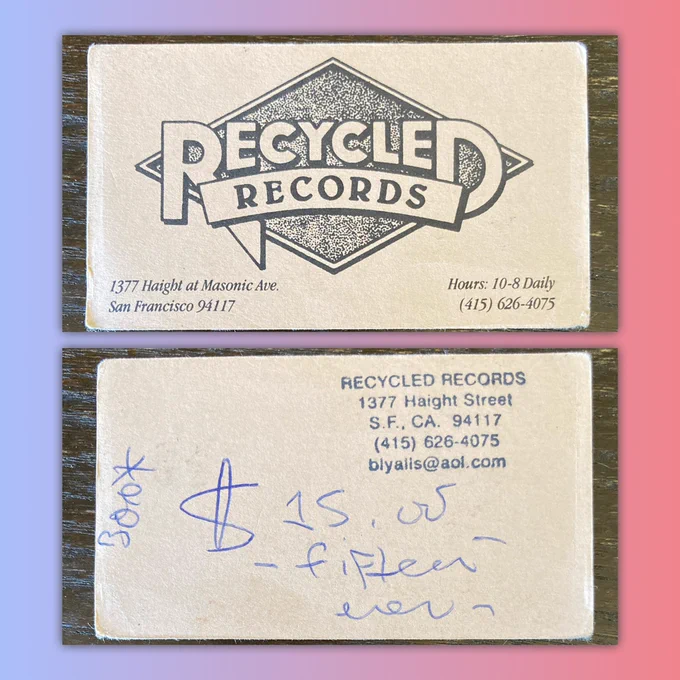 Old business card with the Recycled Records diamond logo on front and a stamped address on the back with “$15.00” credit handwritten in blue ball point pen on the back.