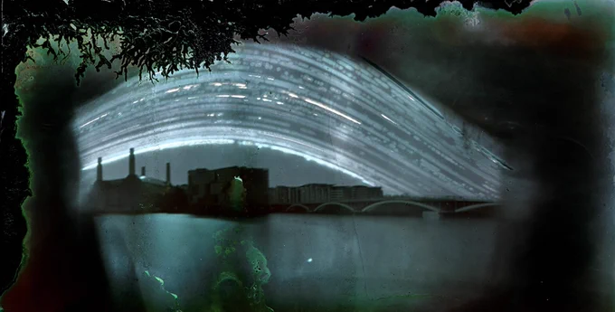 Composite image of buildingscape with abstract shapes in sky bounded in organic shapes