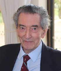 Sam Gallop, chairman of the Guinea Pig Club, who turns 100 today. He's pictured more recently in a dark suit jacket, with a white shirt and the Guinea Pig Club tie
