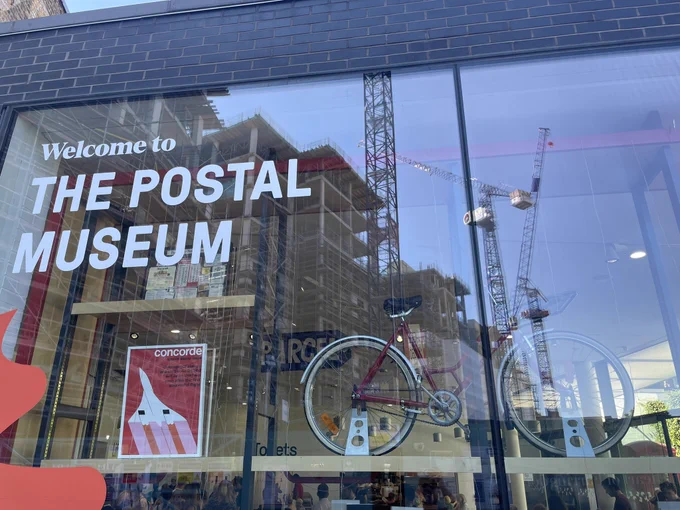 Post office museum window with bicycle in