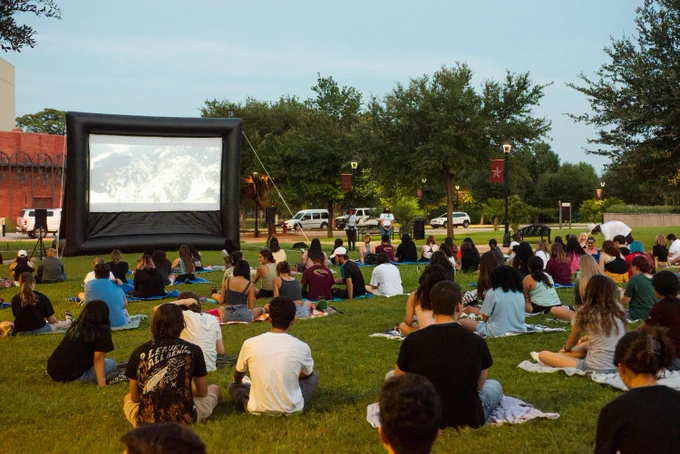TXST students at movie night on the Concho Green