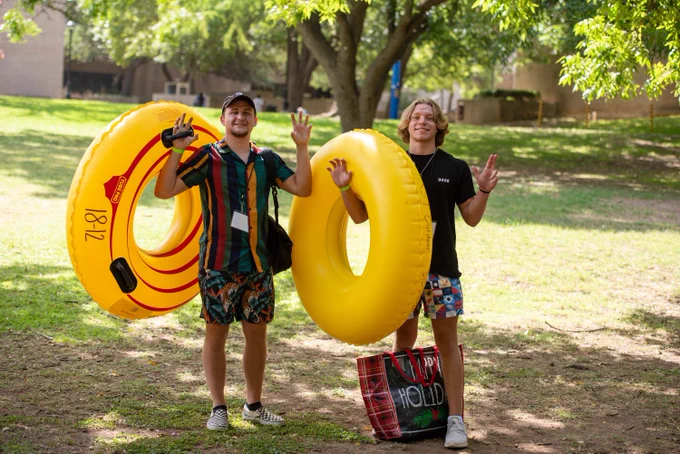 TXST students with river tubes before floating the San Marcos River