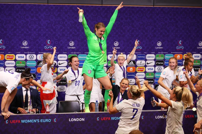 England's players celebrate in the press conference room