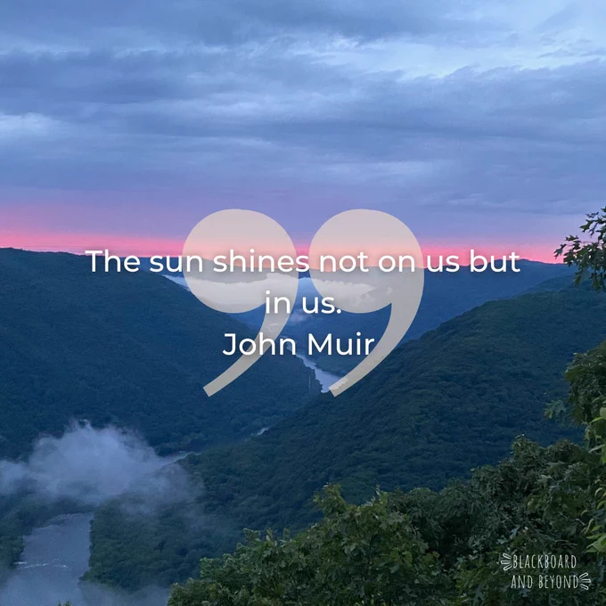 John Muir quote of "The sun shines not on us but in us" written on top of a sunrise picture in the mountains of New River National Park.