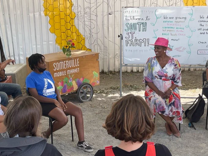 Congresswoman Pressley participates in a discussion with staff and volunteers at Groundwork Somerville. 
