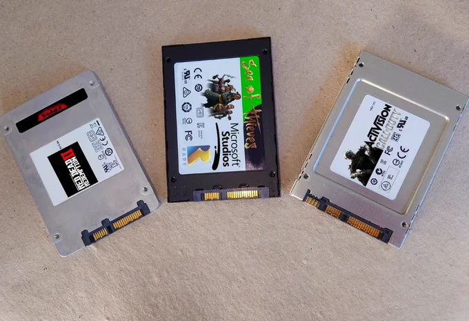 3 ssd drives with stickers that look like rdr2, sot and cod