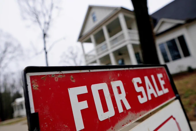 A sign reading "FOR SALE" is shown in front of a house.