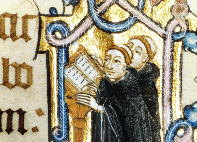Two Benedictine monks reading from the hymn sheet on the Lyttington Missal